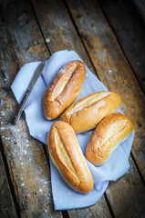 Bread rolls on rustic wooden background