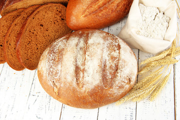 Rye bread with flour on table close up