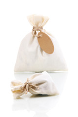 Sackcloth bags with blank label, isolated on white