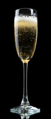 Glass of champagne, on black background