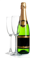 Bottle of champagne and empty glasses, isolated on white