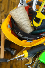 Construction equipment on wooden background