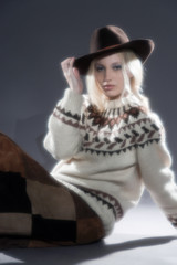 Retro soft focus hippie 70s winter fashion girl with long blonde