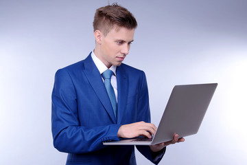 Business man on grey background