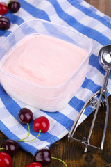 Ice cream in container and ice cream spoon