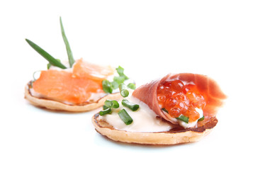 Pancakes with red caviar and salmon,  isolated on white