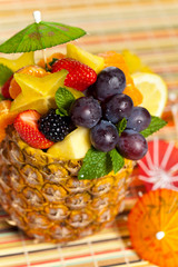 Fresh Fruit Salad in a Pineapple. Selective focus.