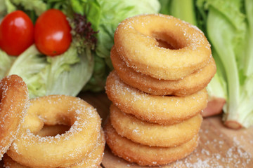 donut and sugar - fresh vegetable salad.