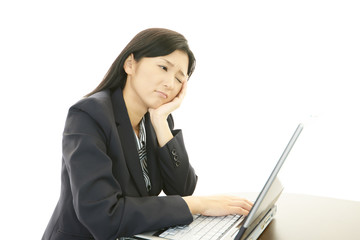 疲れた表情のOL