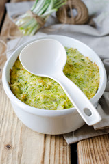 Casserole with cheese and wild garlic