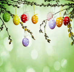easter still life with painted eggs and spring branch
