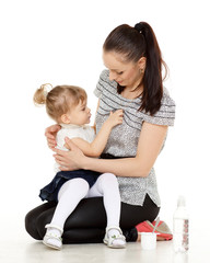 Young mother feeds  her baby.