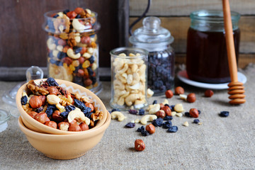 mix nuts in a bowl on the table and jar