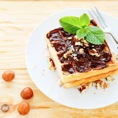 square sweet waffles with chocolate and nuts