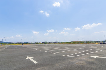 Empty parking lot with blue skies