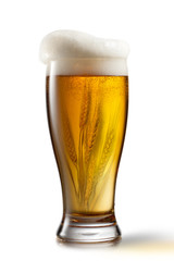 Beer in glass and wheat inside isolated on white background