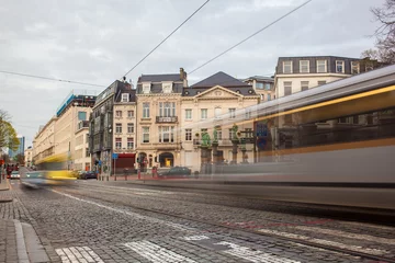 Foto op Plexiglas Brussel Tramway in motion on the street of Brussels near The Sablon Squa