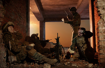 U.S. Marines on a halt. Sunset sky. Good day in the war.