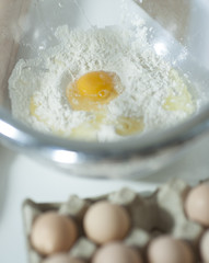 Close-up of raw egg and flour