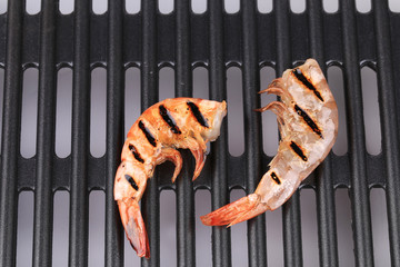 Grilled shrimps on grill.