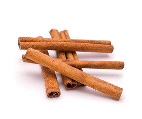 Heap of Cinnamon isolated on white