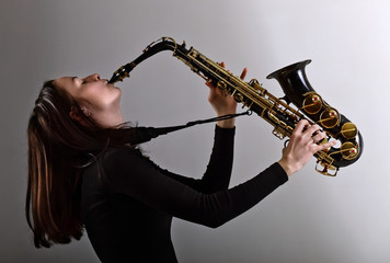 woman in black with saxophone