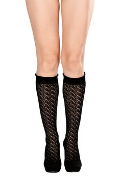 female legs in fishnet socks and shoes