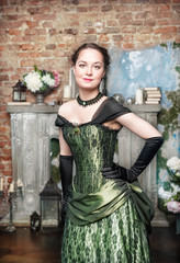 Obraz premium Smiling beautiful woman in medieval dress