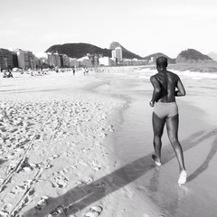 Man is running on copacabana beach, Rio de Jaineiro, Brazil - 62226480