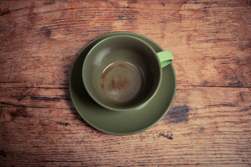 Obraz na płótnie Canvas Empty cup on wooden table