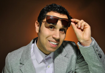 Young businessman smiling with stupid face