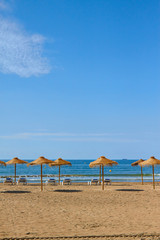 Fototapeta na wymiar beach featuring levels of white sand, emerald water, dark blue w
