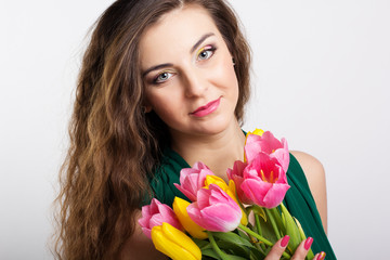 Obraz na płótnie Canvas beautiful girl with tulips