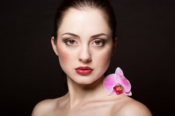Beautiful woman with orchid