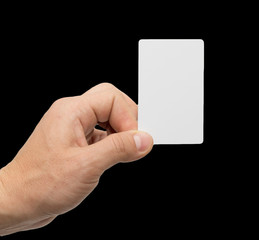 Obraz premium white card in hand on a black background