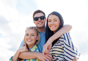 group of friends having fun on the beach