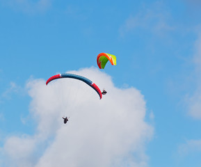 clouds over para gliders