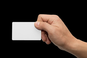 white card in hand on a black background