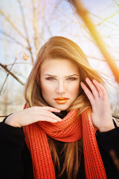 Gorgeous Young Woman With Orange Makeup And Scarf