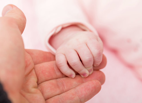 Mother and baby hands