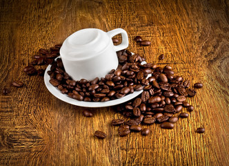 Cup of coffee with coffee beans