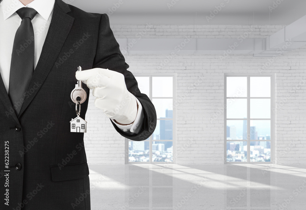 Wall mural businessman holding a key