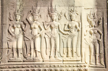 Relief of three dancers in the court of Angkor. Angkor Wat