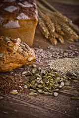 Fototapeta premium fresh bread and wheat on the wooden 