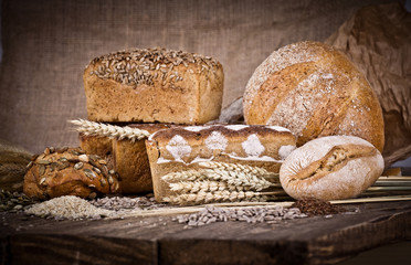 fresh bread and wheat on the wooden 