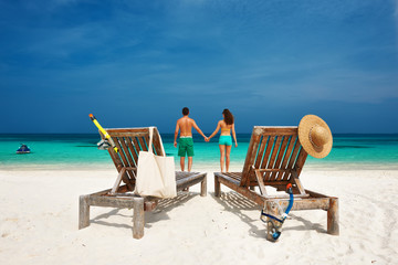 Couple in green on a beach at Maldives