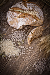 fresh bread and wheat on the wooden - rustic
