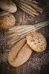 fresh bread and wheat on the wooden - rustic