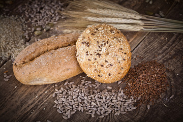 fresh bread and wheat on the wooden - rustic