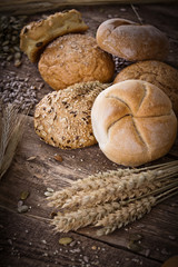fresh bread and wheat on the wooden - rustic